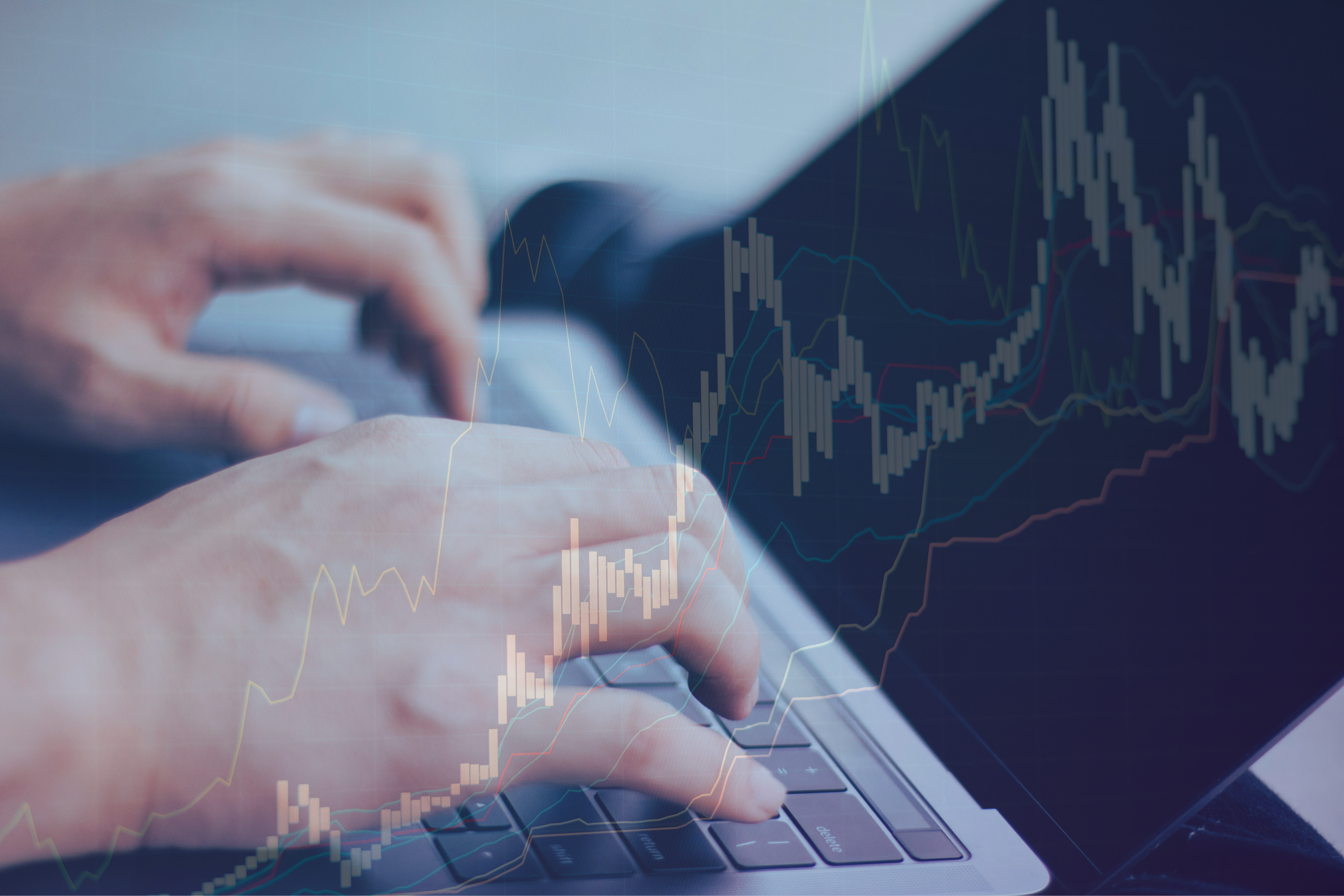 Person using laptop with overlay of graphs and calculations