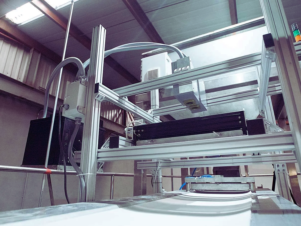 Specim 100x50 labscanner above a conveyor in a food processing facility