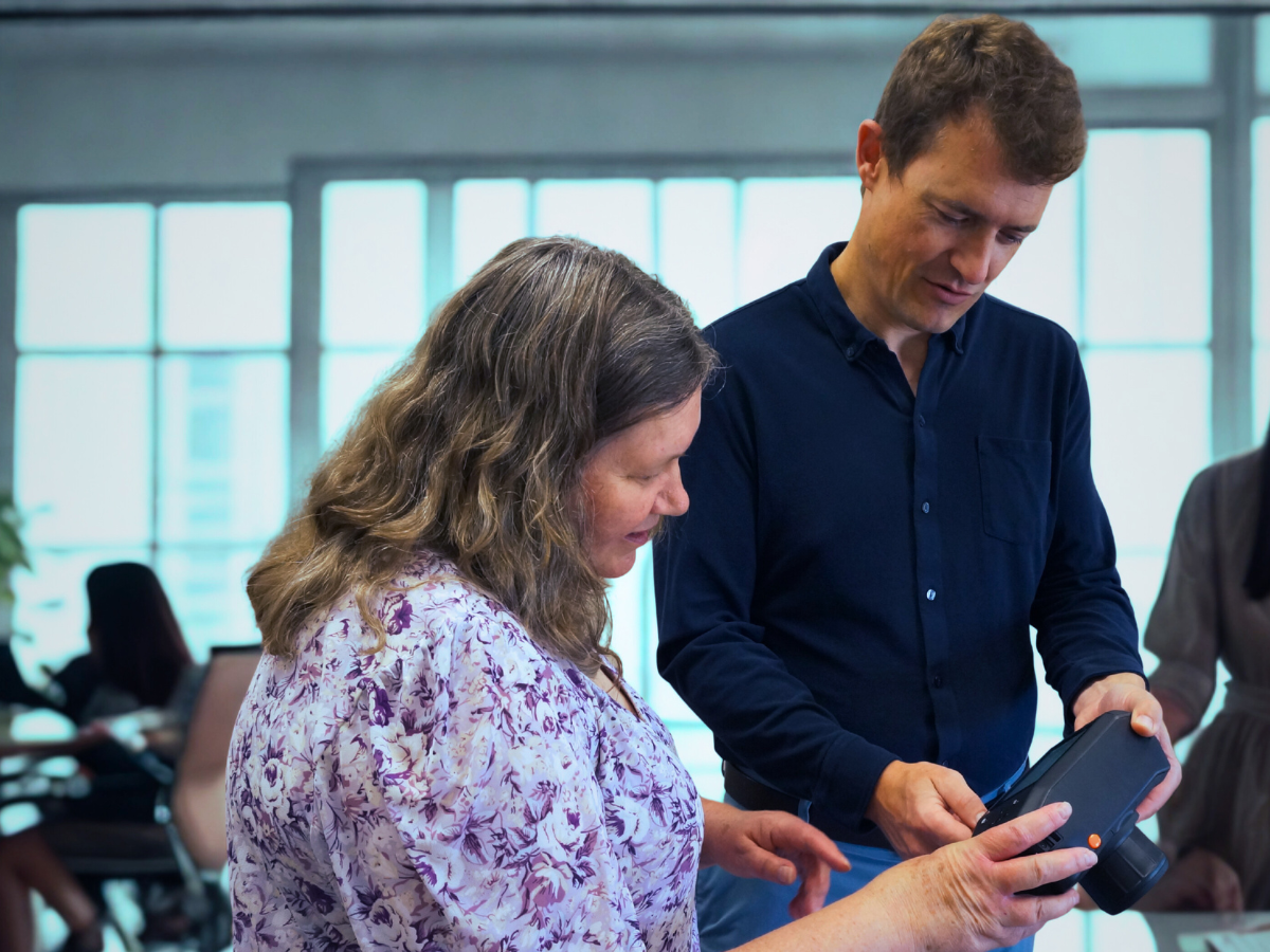 Person demonstrating Specim IQ to another person