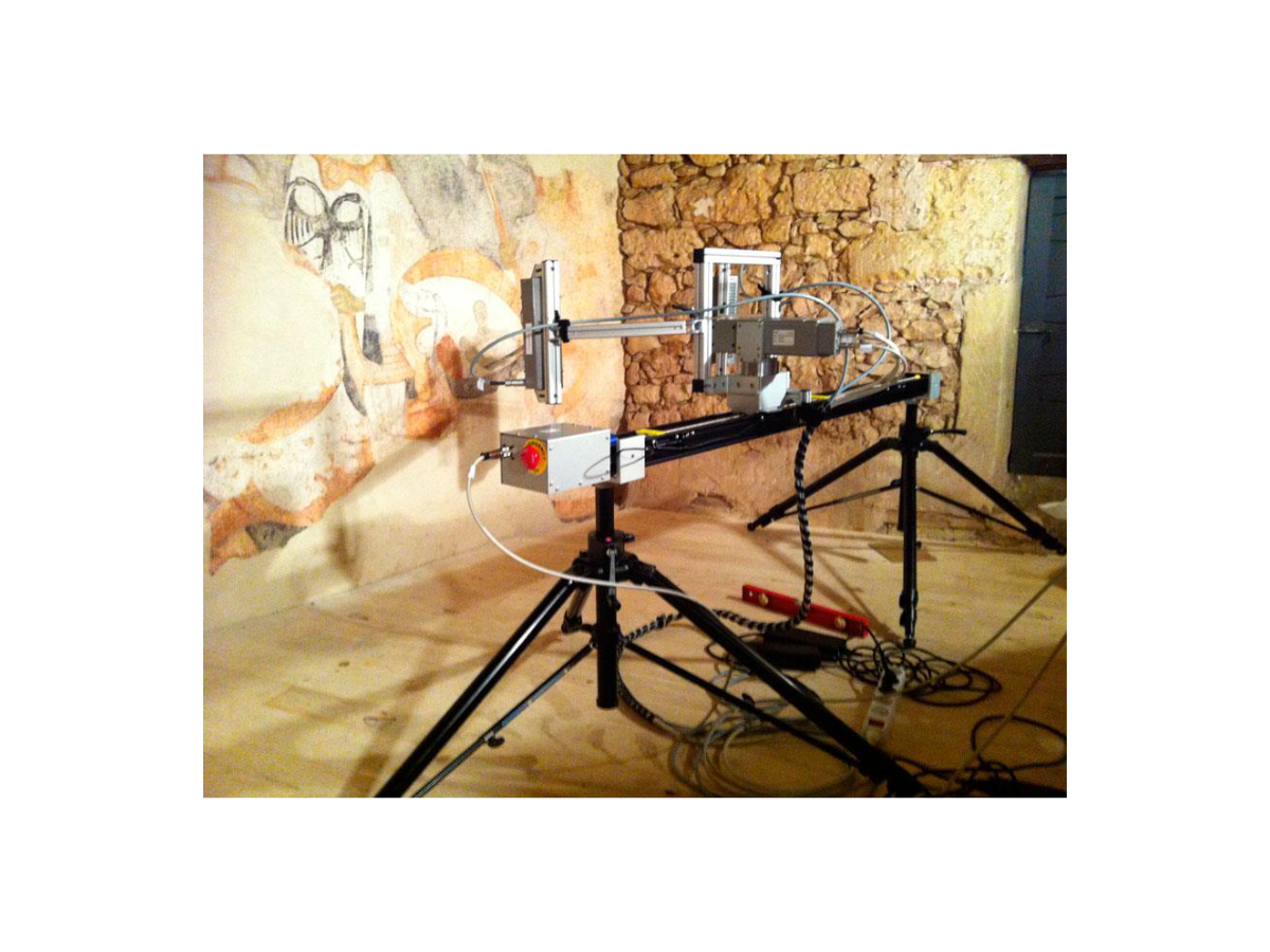 Hyperspectral imaging setup in front of rock wall featuring rock paintings