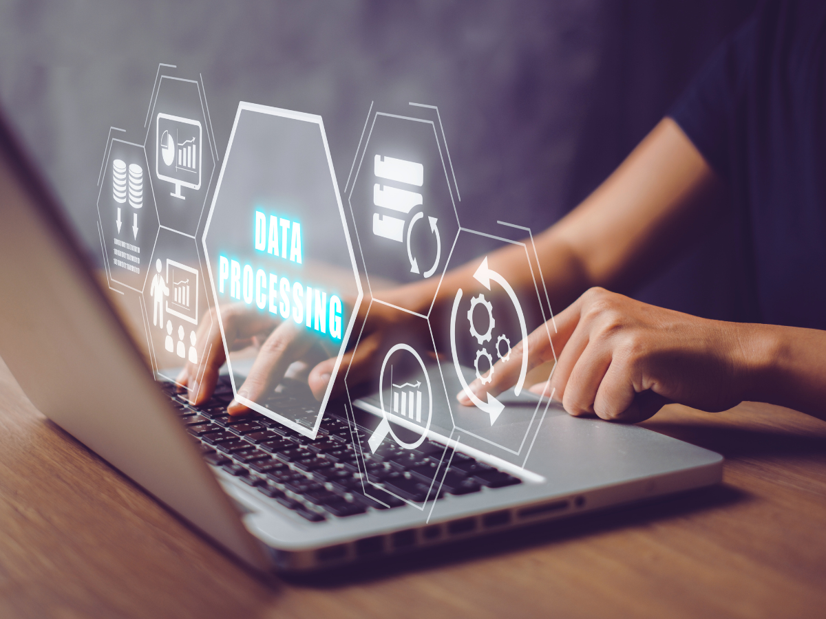 Person on laptop with graphics of different types of data processing