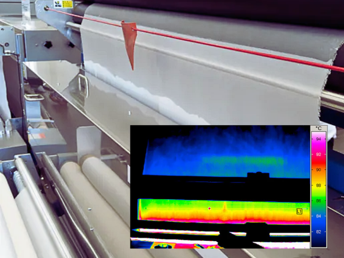 Thin film on a roll in an industrial setting with overlay image of infrared detection of hotspot on film