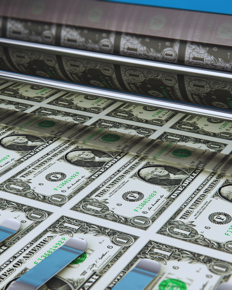 US dollar bills being printed in industrial environment